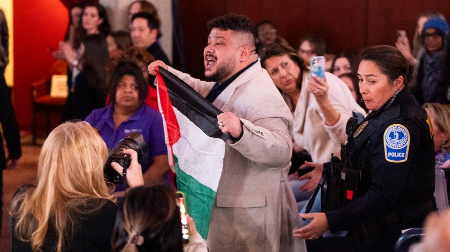 A protester in support of Palestine disrupts President Biden