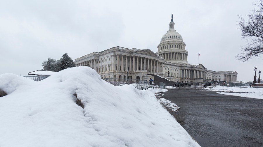 The U.S. Capitol in Washington, D.C., is seen from the East Front Lawn after a snow storm