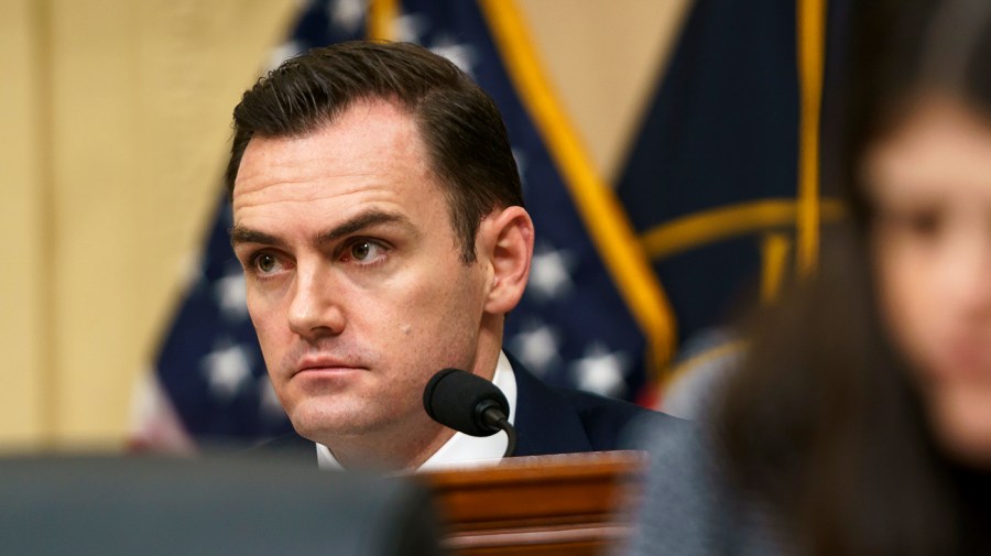 Representative Mike Gallagher is seen during a meeting.