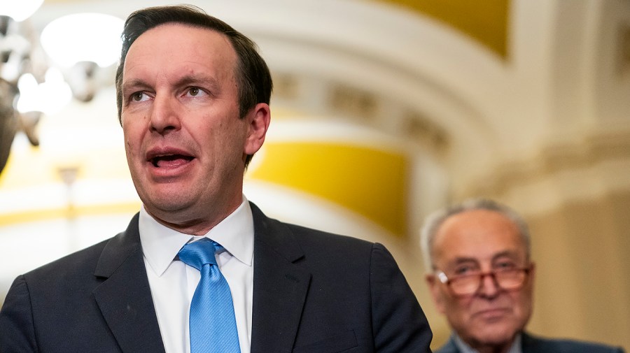 Senator Chris Murphy speaks to reporters.