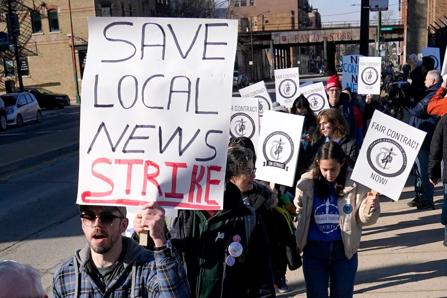 Chicago Tribune newsroom employees picket outside the newspapers Freedom Center newsroom and printing plant Thursday, Feb. 1, 2024, in Chicago. More than 200 reporters, photographers and other staffers with the Tribune and six other newsrooms around the nation are on a 24-hour strike to protest years of "slow-walked" contract negotiations and to demand fair wages. (AP Photo/Charles Rex Arbogast)