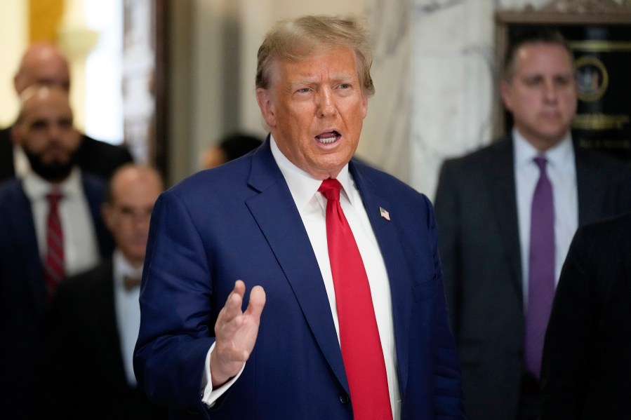 FILE - Former President Donald Trump speaks outside the New York Supreme Court, Jan. 11, 2024, in New York. The case that brings Trump to the U.S. Supreme Court to preserve his right to run again for the presidency began during the summer of 2020, when a bored law professor in Indiana began to research the history of two rarely noticed sentences tucked in the middle of the 14th Amendment. (AP Photo/Seth Wenig, File)