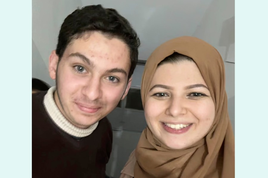 This undated image provided by Yasmeen Elagha shows Elagha, right, with her cousin Borak Alagha. Relatives of Borak Alagha, 28, and Hashem Alagha, 20, two American brothers trapped in Gaza, say Israeli forces have detained the two U.S. citizens, along with their Canadian father, in a raid on their home early Thursday, Feb. 8, 2024. (Yasmeen Elagha via AP)