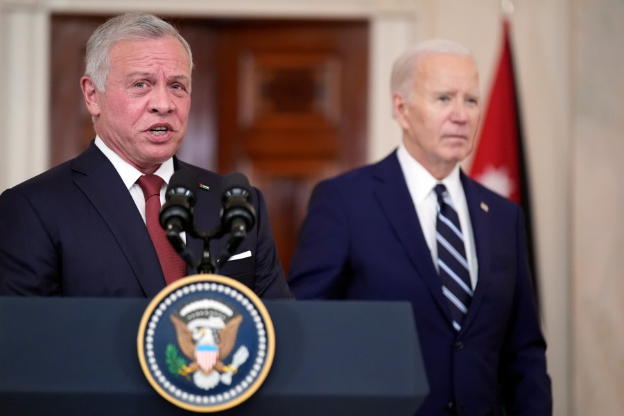 Jordan's King Abdullah II speaks as President Joe Biden listens in the Cross Hall of the White House, Monday, Feb. 12, 2024, in Washington. (AP Photo/Andrew Harnik)