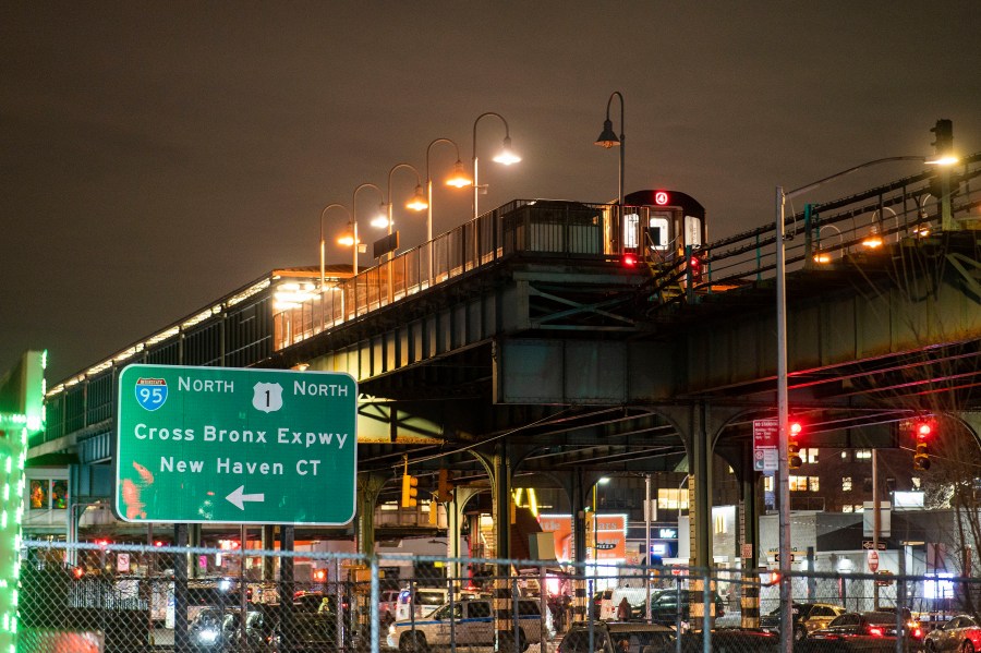 A subway train remains in investigation by police officers after a shooting at the Mount Eden Avenue subway station, Monday, Feb. 12, 2024, in the Bronx borough of New York. (AP Photo/Eduardo Munoz Alvarez)