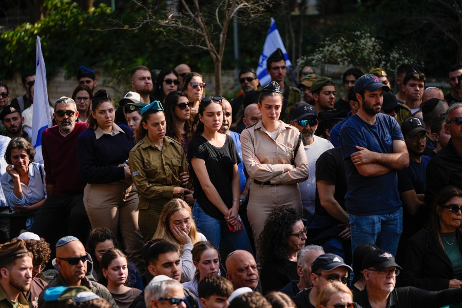 Israelis mourn in grief during the funeral of Sergeant Oz Daniel in Kfar Saba, Israel, Monday, Feb. 26, 2024. Daniel, 19, believed to have been among those killed in the initial Oct. 7 Hamas attack, was declared dead by the military, with his remains still in Gaza. (AP Photo/Ohad Zwigenberg)