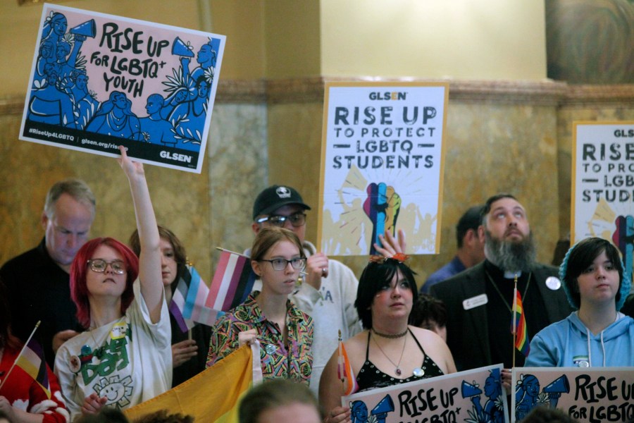 FILE - Kansas high school students, family members and advocates rally for transgender rights, Wednesday, Jan. 31, 2024, at the Statehouse in Topeka, Kan. Kansas enacted a law last year that ended legal recognition of transgender identities. The measure says there are only two sexes, male and female, that are based on a person’s “biological reproductive system" at birth. (AP Photo/John Hanna, File)