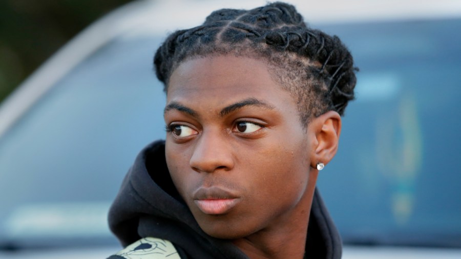 FILE - Darryl George, then a 17-year-old junior, is seen before walking across the street to go into Barbers Hill High School after serving a 5-day in-school suspension for not cutting his hair Monday, Sept. 18, 2023, in Mont Belvieu, Texas.