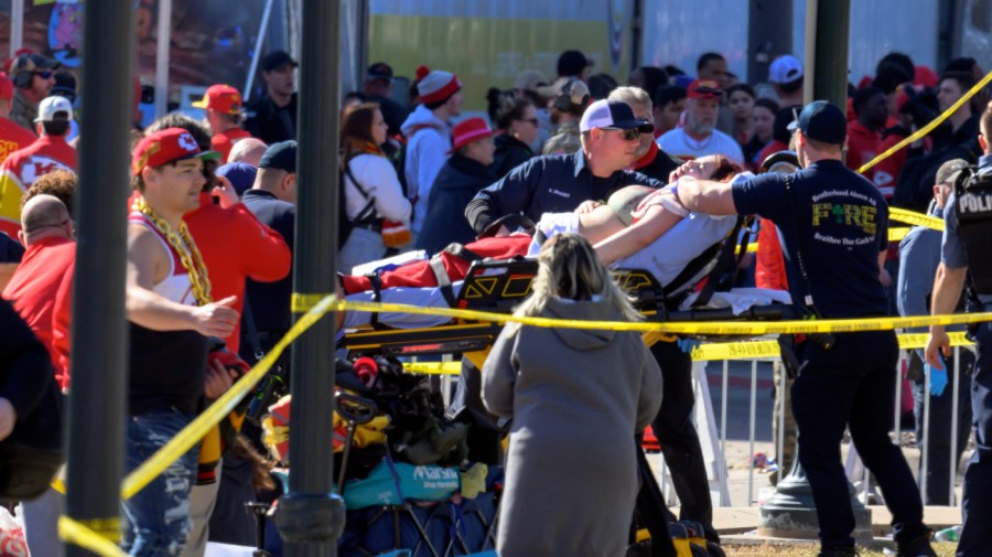 woman is taken to an ambulance after an incident following the Kansas City Chiefs NFL football Super Bowl celebration in Kansas City, Mo., Wednesday, Feb. 14, 2024. The Chiefs defeated the San Francisco 49ers Sunday in the Super Bowl 58.