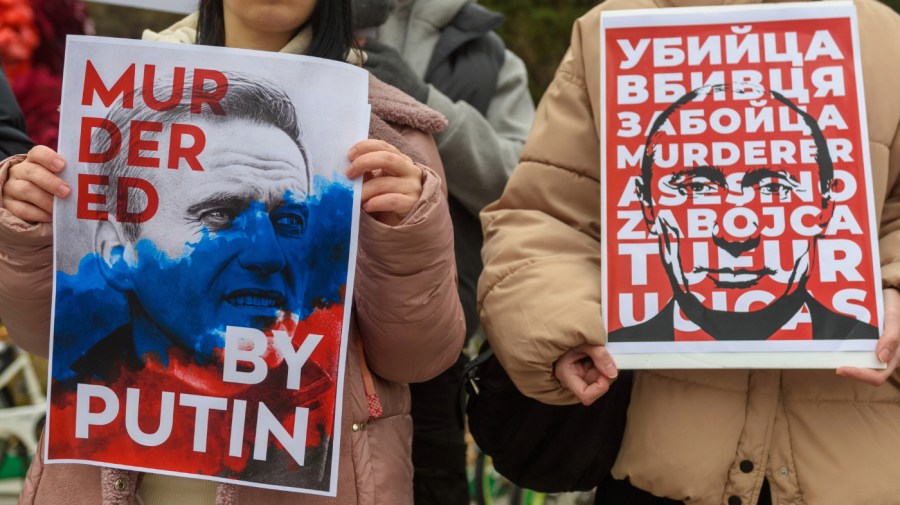 Russians hold placards protesting against Alexei Navalny's death and against the war with Ukraine on Feb. 25, 2024. (Photo by KIM Jae-Hwan/SOPA Images/LightRocket via Getty Images)