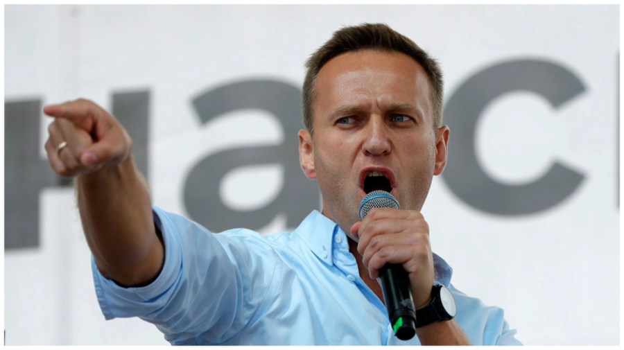 FILE - Russian opposition activist Alexei Navalny gestures while speaking to a crowd during a political protest in Moscow, Russia on July 20, 2019. (AP Photo/Pavel Golovkin, File)