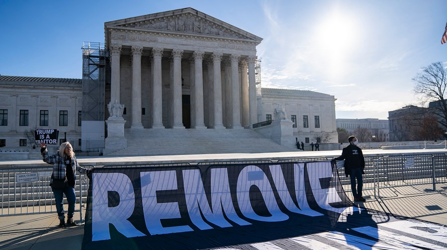 People against former President Trump gather outside the Supreme Court in Washington, D.C., ahead of oral arguments in Trump v. Anderson