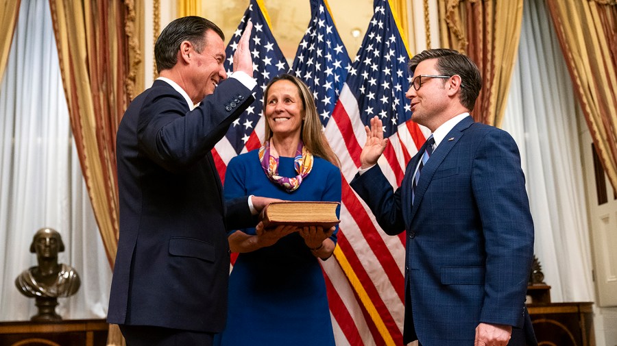 Rep. Tom Suozzi (D-N.Y.) and Speaker Mike Johnson (R-La.)