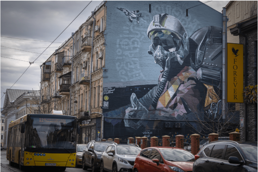 A mural depicts a Ukrainian pilot showing a thumbs-up sign on an apartment building wall in Kyiv, Ukraine, Friday, Jan. 19, 2024.