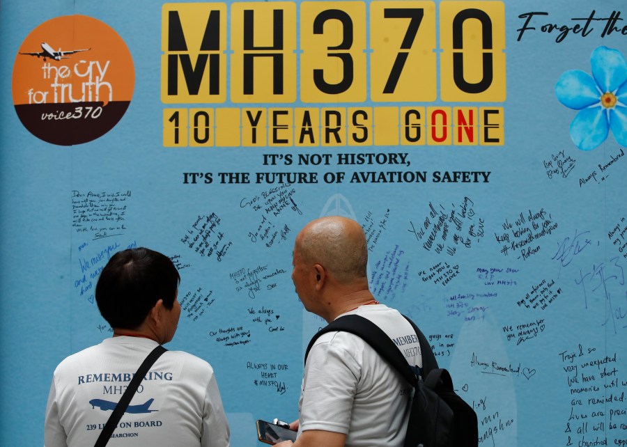 Family members of passengers on board from China of the missing Malaysia Airlines Flight 370 look at the messages board during the tenth annual remembrance event at a shopping mall, in Subang Jaya, on the outskirts of Kuala Lumpur, Malaysia, Sunday, March 3, 2024. Ten years ago, a Malaysia Airlines Flight 370, had disappeared March 8, 2014 while en route from Kuala Lumpur to Beijing with 239 people on board. (AP Photo/FL Wong)