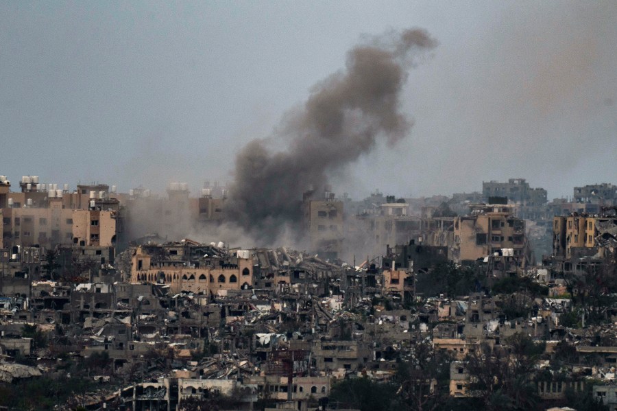 Smoke rises to the sky following an explosion in the Gaza Strip, as seen from southern Israel, Friday, March 8, 2024. (AP Photo/Leo Correa)