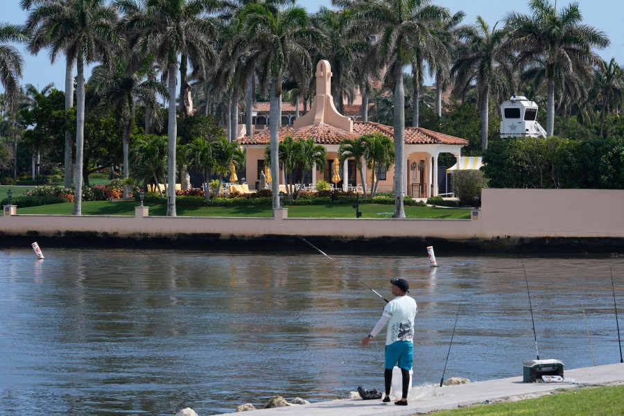 A fisherman casts a line near Mar-a-Lago, as former President Donald Trump is planning to meet Hungarian Prime Minister Victor Orban, Friday, March 8, 2024, in Palm Beach, Fla. (AP Photo/Marta Lavandier)