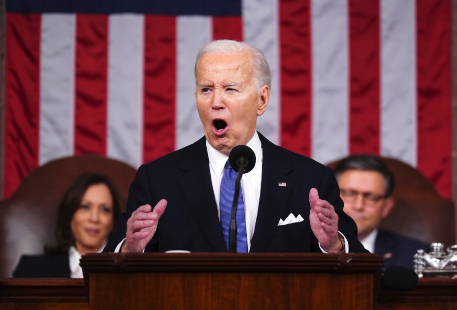 FILE - President Joe Biden delivers the State of the Union address to a joint session of Congress at the Capitol, March 7, 2024, in Washington. Seated at left is Vice President Kamala Harris and at right is House Speaker Mike Johnson, R-La. Biden made abortion and reproductive rights a central theme of his State of the Union speech, but he never mentioned the word "abortion." Pushback over how he addressed the issue is the latest example of Biden's fraught history with the topic. (Shawn Thew/Pool via AP, File)