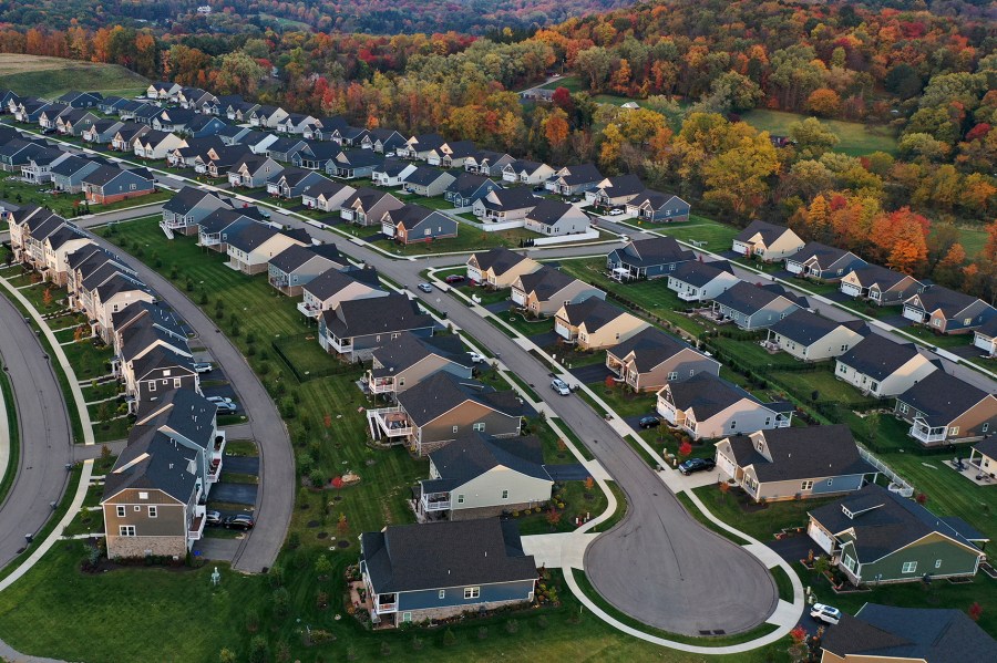 FILE - A new housing development is seen from above, Oct. 12, 2022, in Middlesex Township, Pa. Real estate brokerage company Compass Inc. will pay $57.5 million as part of a proposed settlement to resolve lawsuits over real estate commissions, the company said in a regulatory filing Friday, March 22, 2024. (AP Photo/Gene J. Puskar, File)