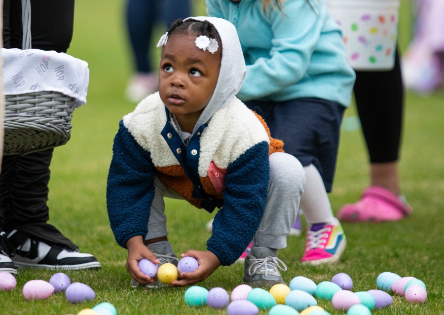 FILE - A youngster collects Easter eggs during an egg hunt at Easterfest at the Bowling Green Ballpark in Bowling Green, Ky., April 8, 2023. In 2024, for the second year in a row consumers have faced sticker shock ahead of Easter and Passover, events in which eggs play prominent roles. (Grace Ramey/Daily News via AP, File)