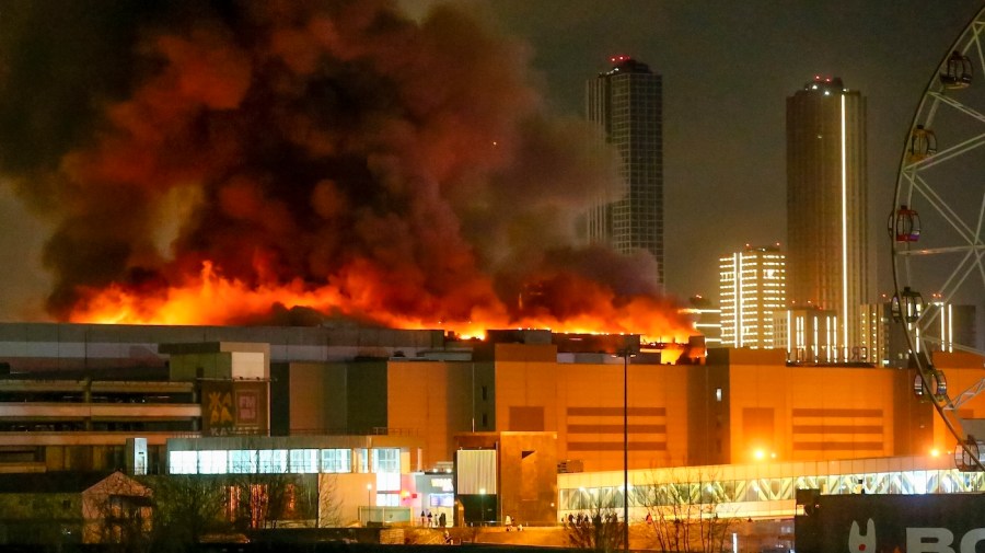 Smoke from a massive blaze rises over buildings in Moscow.