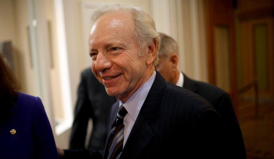 Sen. Joe Lieberman talks with fellow senators.