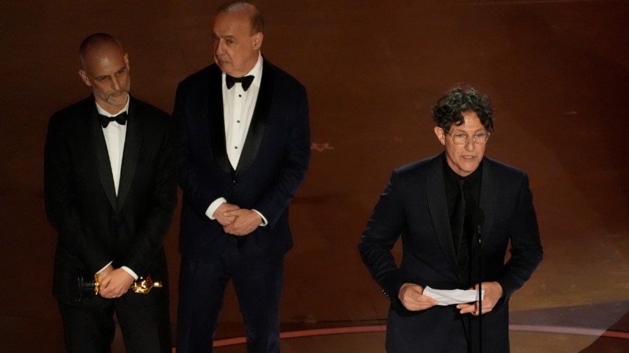 James Wilson, from left, Leonard Blavatnik, and Jonathan Glazer accept the award for "The Zone of Interest" from the United Kingdom, for best international feature film during the Oscars on Sunday, March 10, 2024, at the Dolby Theatre in Los Angeles.