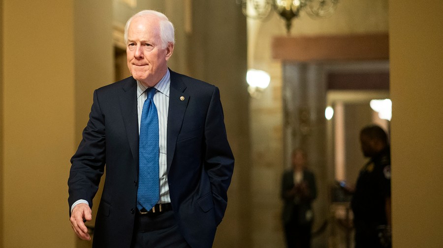 Senator John Cornyn walks through the Capitol.