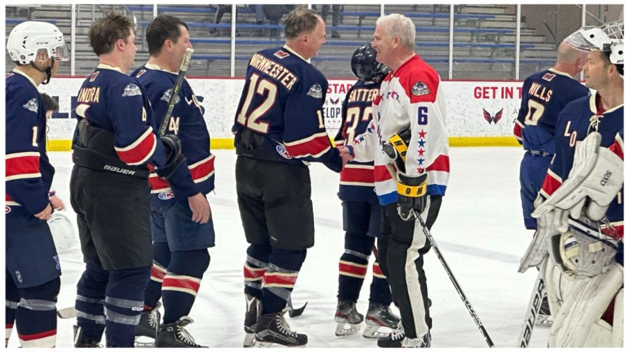 Rep. Tom Emmer (R-Minn.) shakes hands with Justin Wormeester and his lobbyist teammates after taking home a sixth consecutive win for the lawmakers at MedStar Capital Iceplex in Arlington, Virginia, on Tuesday, March 12, 2024.