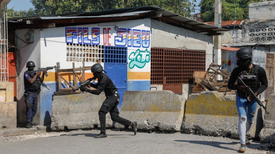 National Police patrol the area near the empty National Penitentiary after a small fire inside the jail in downtown Port-au-Prince, Haiti, on Thursday, March 14, 2024. This is the same prison that armed gangs stormed late March 2 and hundreds of inmates escaped.