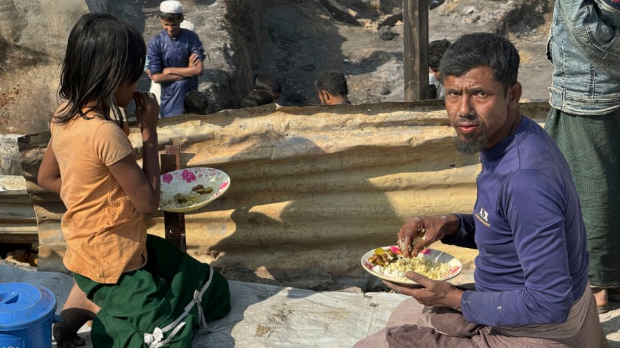 Rohingya refugees have food after a midnight fire raced through their refugee camp at Kutupalong in Cox's Bazar district, Bangladesh, Sunday, Jan. 7, 2024.