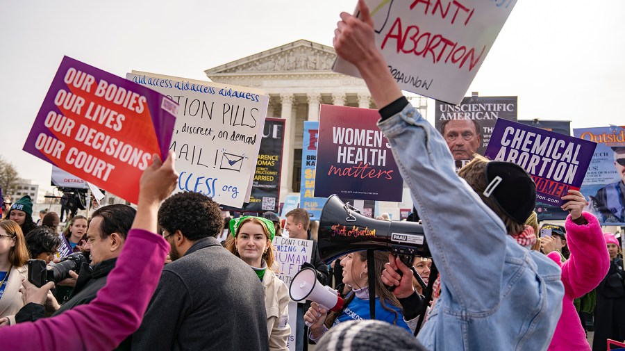 Protesters for and against abortion demonstrate outside the Supreme Court