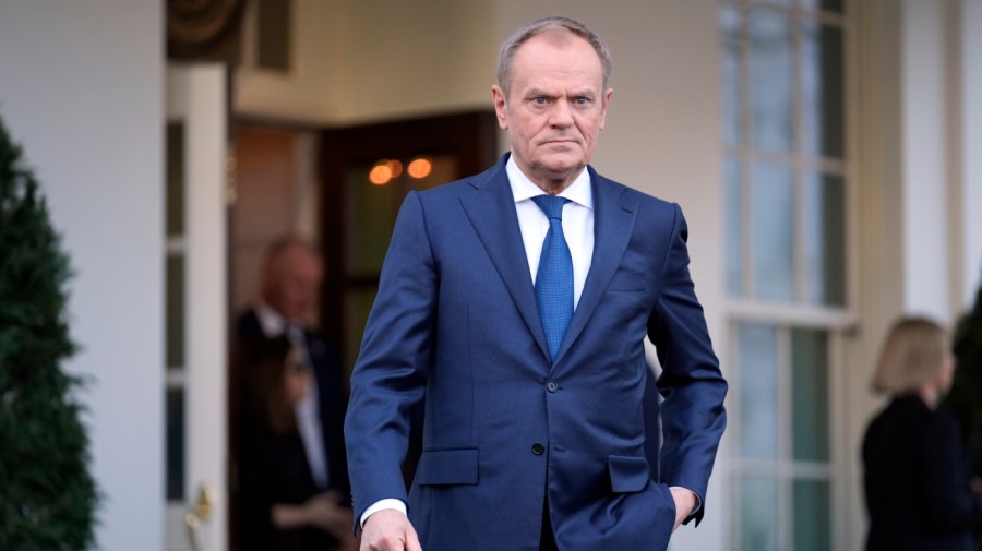 Polish Prime Minister Donald Tusk walks to speak with reporters outside the West Wing of the White House after meeting with President Joe Biden Tuesday, March 12, 2024, in Washington.