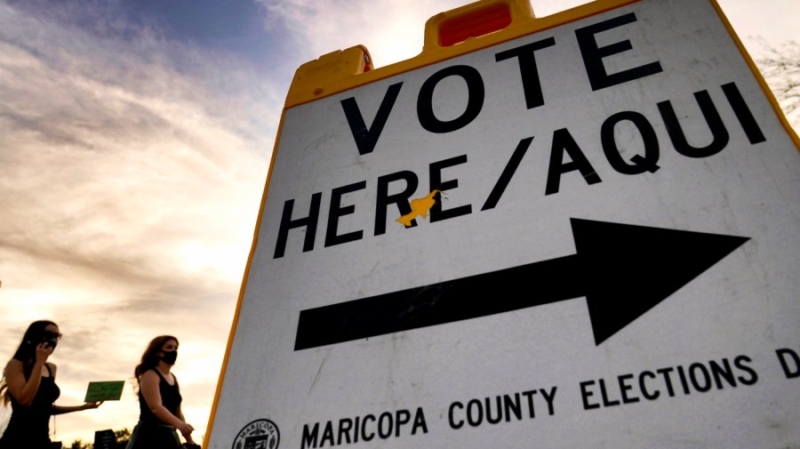 Voters deliver their ballot to a polling station in Tempe, Ariz., on Nov. 3, 2020. In a ruling Thursday, Feb. 29, 2024.