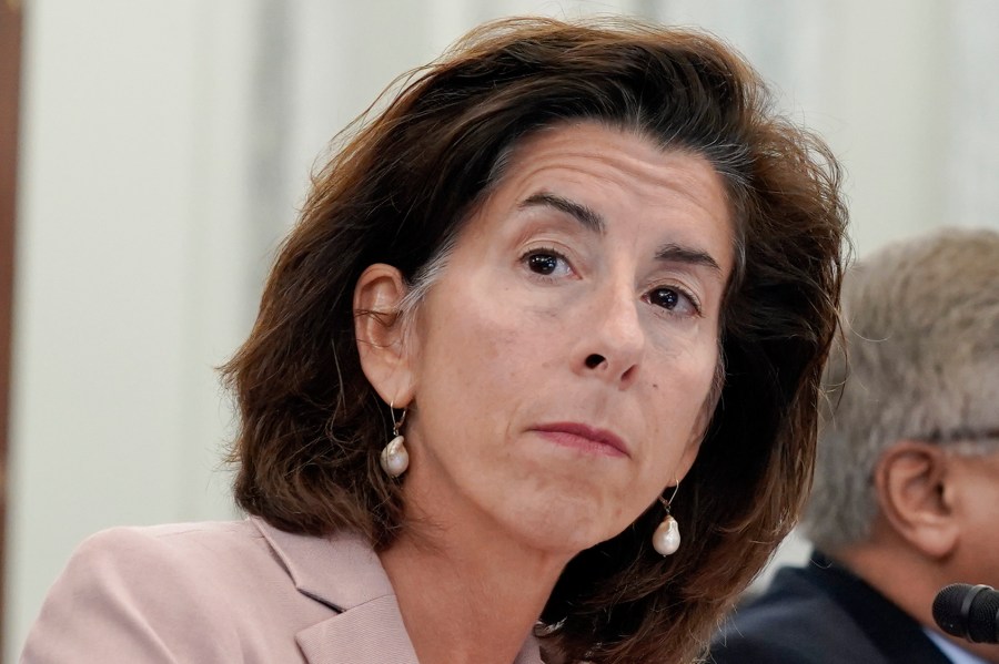 FILE - Commerce Secretary Gina Raimondo, left, listens during a Senate Commerce, Science, and Transportation hearing titled "CHIPS and Science Implementation and Oversight", Wednesday, Oct. 4, 2023, on Capitol Hill in Washington. a scathing indictment of Microsoft corporate security and transparency, a Biden administration-appointed review board issued a report Tuesday, April 2, 2024, saying “a cascade of errors” by the tech giant let state-backed Chinese cyber operators break into email accounts of senior U.S. officials including Commerce Secretary Gina Raimondo. (AP Photo/Mariam Zuhaib, File)