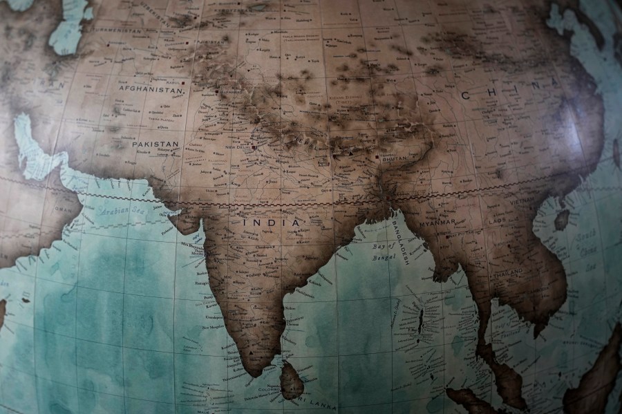 Map of India, Pakistan and Nepal are shown on a globe at a studio in London, Tuesday, Feb. 27, 2024. Globes in the age of Google Earth capture the imagination and serve as snapshots of how the owners see the world and their place in it. Peter Bellerby made his first globe for his father, after he could not find one accurate or attractive enough. In 2008, he founded Bellerby & Co. Globemakers in London. His team of dozens of artists and cartographers has made thousands of bespoke globes up to 50 inches in diameter. The most ornate can cost six figures. (AP Photo/Kin Cheung)