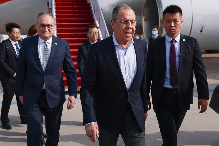 In this photo released by Russian Foreign Ministry Press Service on Monday, April 8, 2024, Russian Foreign Minister Sergey Lavrov, center, walks from the plane upon his arrival in Beijing, China. Russian Foreign Minister Sergey Lavrov is visiting Beijing to display the strength of ties with close diplomatic ally China amid Moscow's grinding war against Ukraine. (Russian Foreign Ministry Press Service via AP)