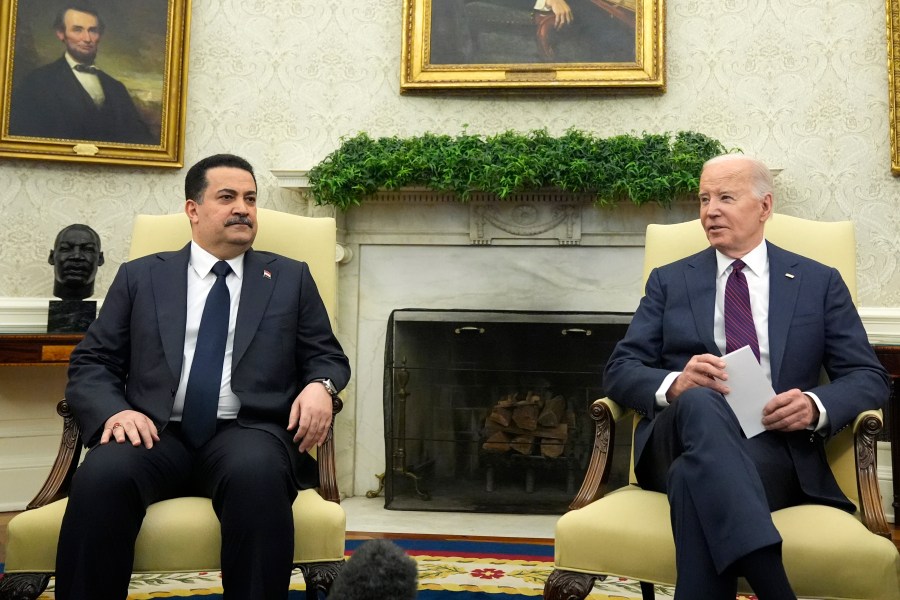 President Joe Biden, right, meets with Iraq's Prime Minister Shia al-Sudani in the Oval Office of the White House, Monday, April 15, 2024, in Washington. (AP Photo/Alex Brandon)