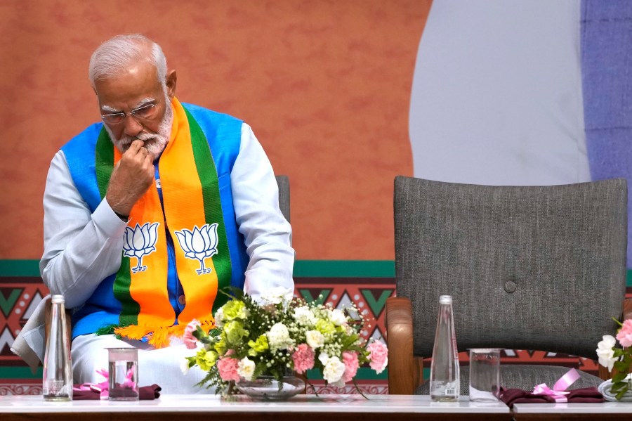 FILE- Indian Prime Minister Narendra Modi listens to Bharatiya Janata Party (BJP) President JP Nadda speak during an event organized to release their party's manifesto for the upcoming national parliamentary elections in New Delhi, India, April 14, 2024. India's main opposition party is accusing Modi of hate speech after he called Muslims “infiltrators" and used some of his most incendiary rhetoric to date about the minority faith.(AP Photo/Manish Swarup, File)