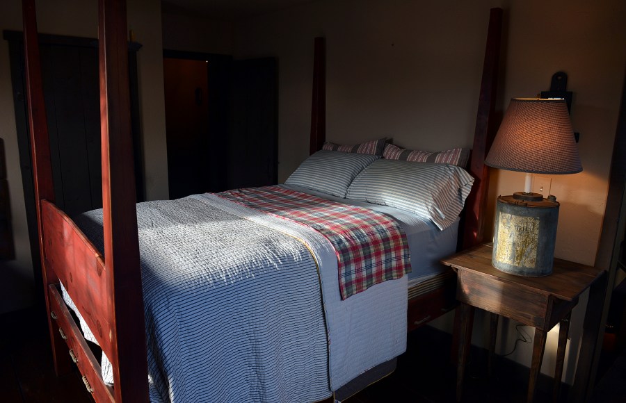 FILE - This Nov. 11, 2013 file photo shows a bedroom built by Mike Spangler using some reclaimed materials, in Belle, W.Va. Nearly one-third of American adults don't get the recommended seven to nine hours of sleep per night. Some of the major causes: Stress, anxiety and a culture that experts say is about productivity, not rest. (Craig Cunningham/Charleston Daily Mail via AP, file)