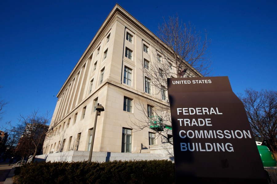 FILE - The Federal Trade Commission building is seen, Jan. 28, 2015, in Washington. U.S. companies would no longer be able to bar employees from taking jobs with competitors under a rule approved by the FTC on Tuesday, April 23, 2024, though the rule seems sure to be challenged in court. (AP Photo/Alex Brandon, File)