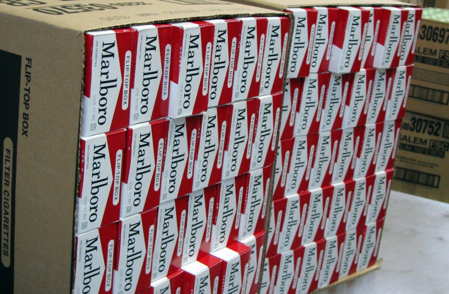 This July 29, 2013, photo shows a case of freshly-stamped Marlboro cigarette cartons at M. Amundson Cigar & Candy Co. in Minneapolis. Smokers in Minneapolis will pay some of the highest cigarette prices in the country after the City Council voted unanimously Thursday, april 25, 2024 to impose a minimum retail price of $15 per pack to promote public health. (Mark Zdechlik/Minnesota Public Radio via AP, file)