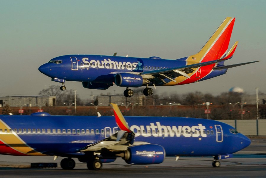 FILE - Southwest Airlines plane prepares to land at Midway International Airport, Feb. 12, 2023, in Chicago. Flight attendants at Southwest Airlines on Wednesday, April 24, 2024, ratified a contract that includes pay raises totaling more than 33% over four years, as airline workers continue to benefit from the industry's recovery since the pandemic. (AP Photo/Kiichiro Sato, File)