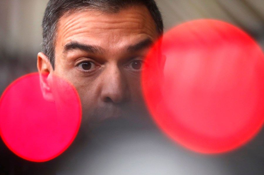 FILE. Spain's Prime Minister Pedro Sanchez speaks on camera as he arrives for an EU summit at the European Council building in Brussels, Thursday, Oct. 1, 2020. Sánchez says he will continue in office "even with more strength" after days of reflection. Sánchez shocked the country last week when he said he was taking five days off to think about his future after a court opened preliminary proceedings against his wife on corruption allegations. (AP Photo/Francisco Seco, File)