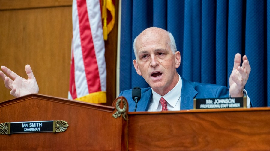 Representative Adam Smith gestures during a meeting.