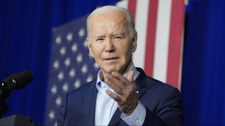 President Biden gestures while speaking at an event.