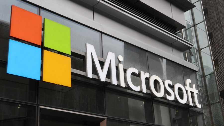 A sign with the Microsoft logo is seen on a building.