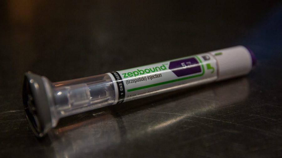 An Eli Lilly & Co. Zepbound injection pen is seen on a table.