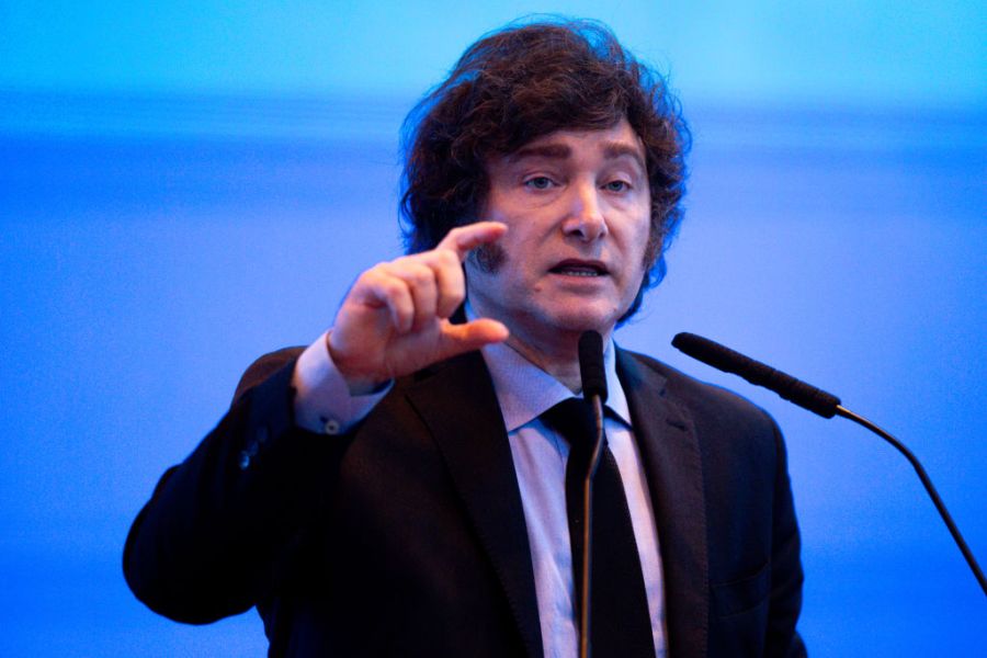 Javier Milei gestures while delivering a speech.