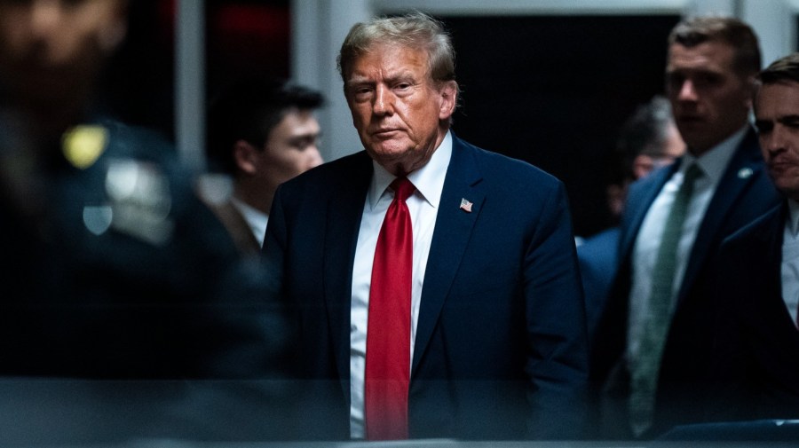 Former President Trump walks out of the courtroom.